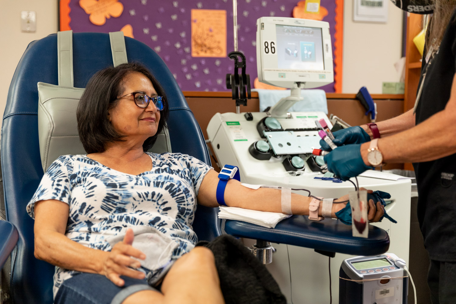 RHA Events: Woman donating blood at a Vitalant Blood Drive event